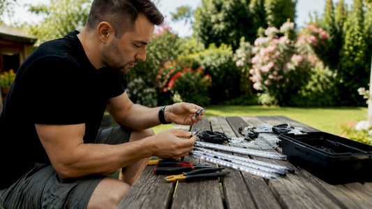 Man comparing automotive LED lighting parts outdoors
