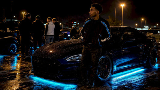 Young man at nighttime car meet with neon underglow lighting