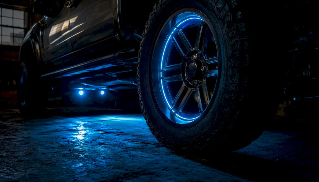 Truck wheel ring and rock lights glowing at dusk