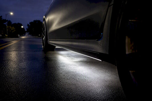 White underglow reflecting on a damp street