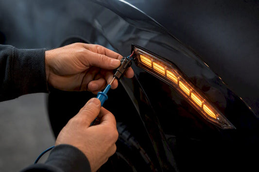 Technician testing segmented side marker wiring