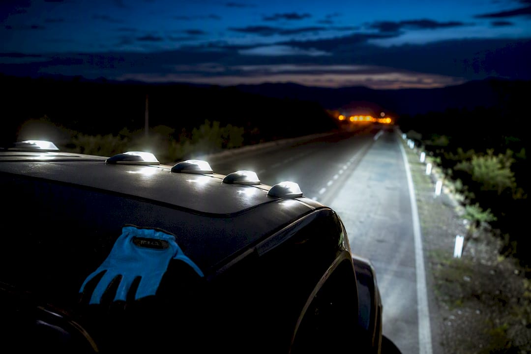 LED cab lights illuminating a dark highway