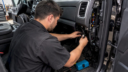 Technician fitting truck lighting harness