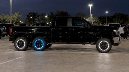 Pickup with wheel lights at a private truck meet